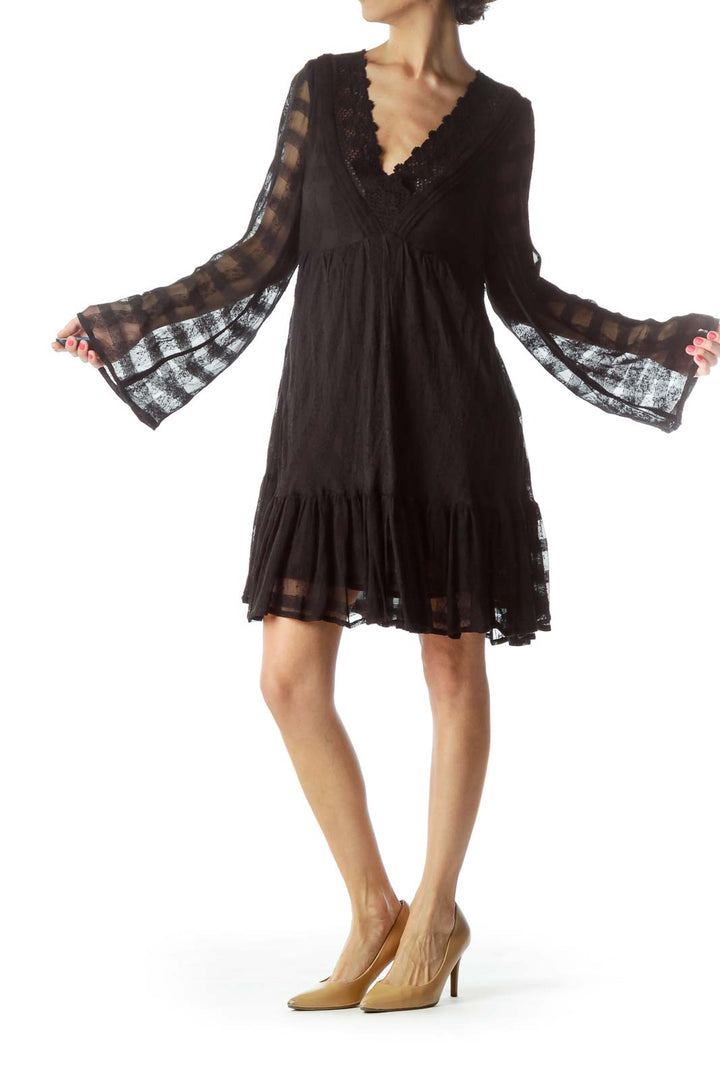 Front view of Free People black lace mini dress with bell sleeves