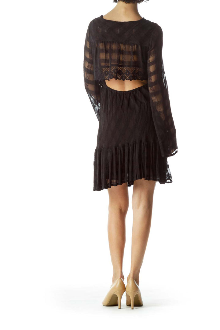 Back view of Free People black lace mini dress showing open back detail