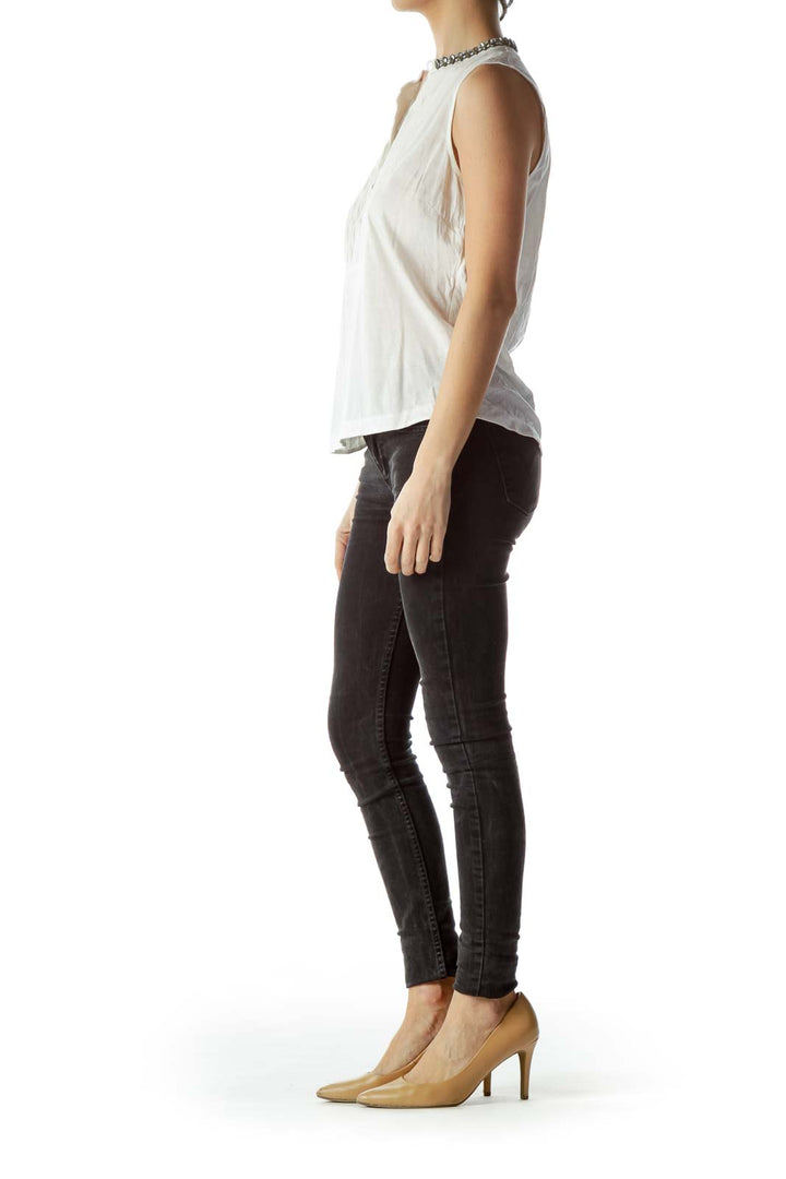 Front view of J.Crew white sleeveless blouse with pleated front and embellished collar
