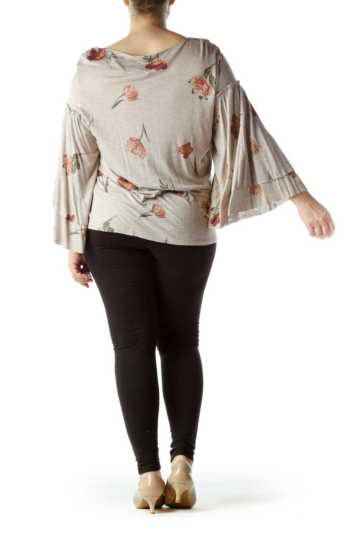 Back view of Lucky Brand beige floral top showing all-over print and bell sleeves