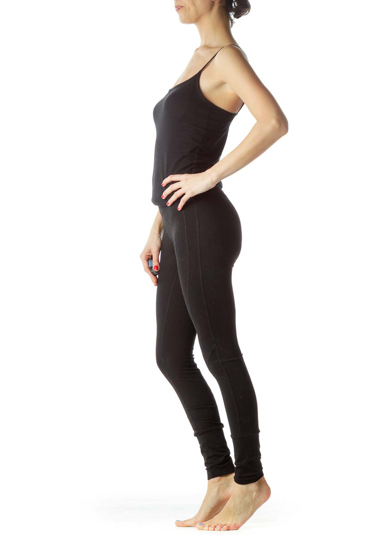 Front view of Zella black high-waisted yoga leggings on model