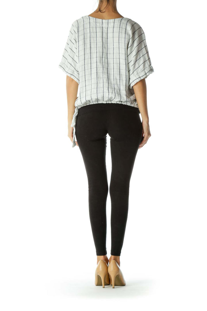 Back view of Free People white striped wrap top showing loose fit and short sleeves