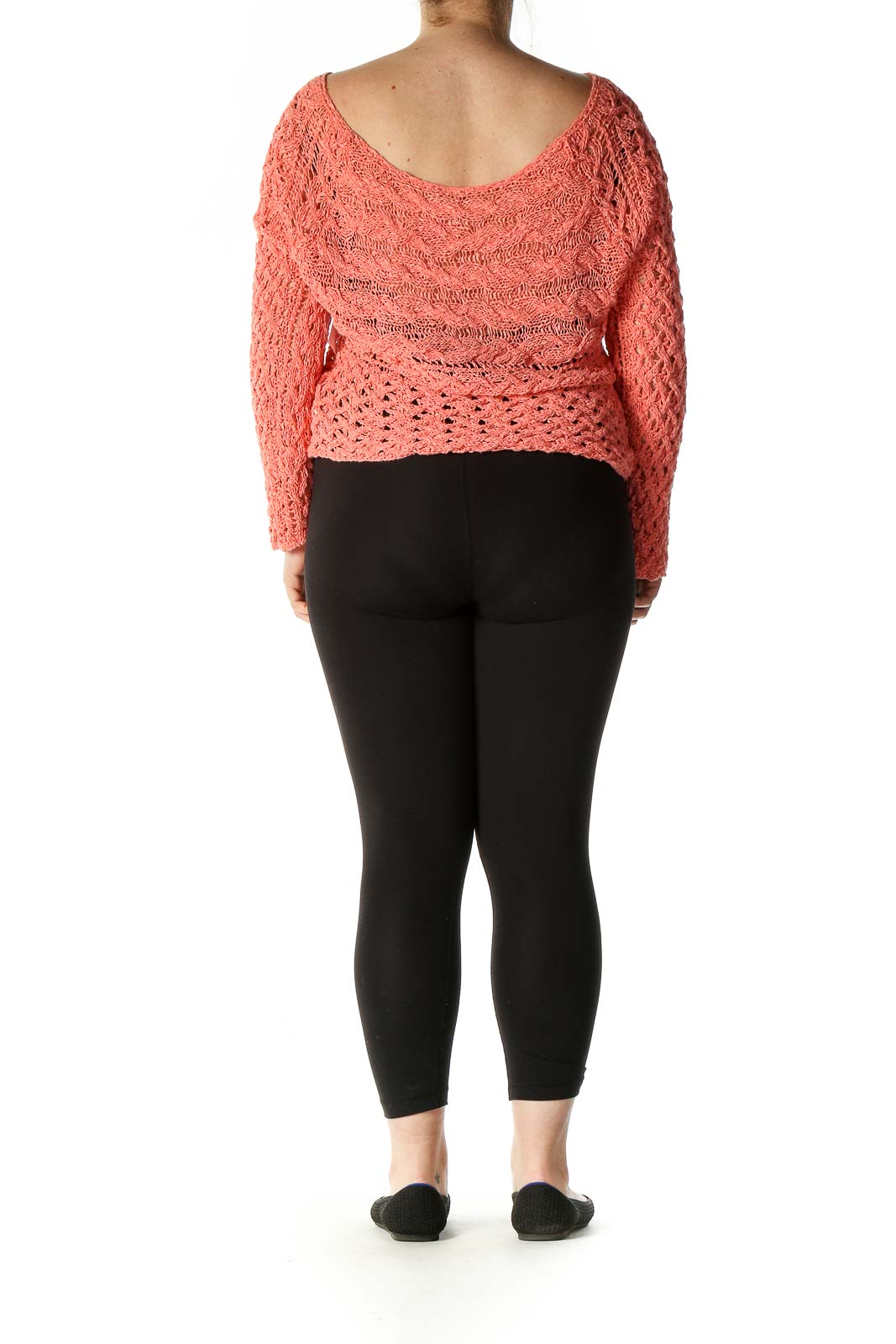 Back view of Free People coral crochet knit crop sweater showing wide boat neckline and long sleeves
