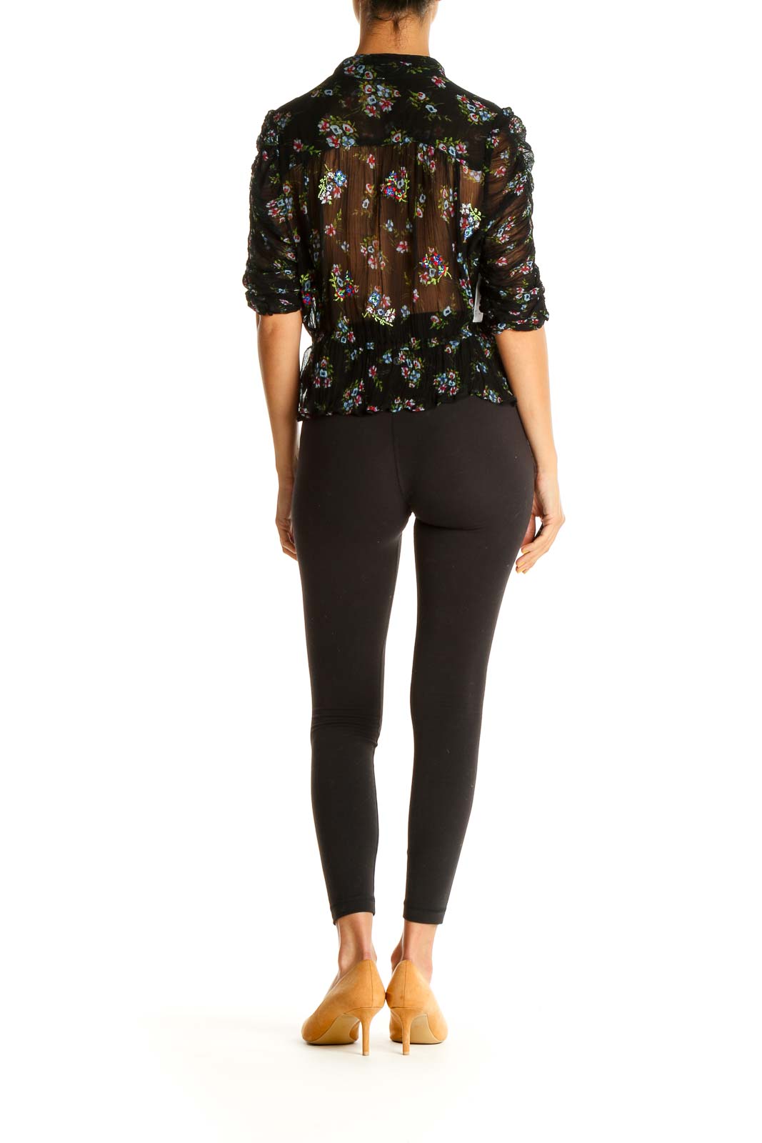 Back view of Free People black sheer floral peplum blouse showing all-over print