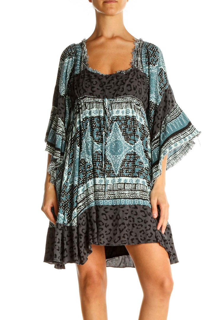 Front view of Free People blue and black patterned boho mini dress with bell sleeves