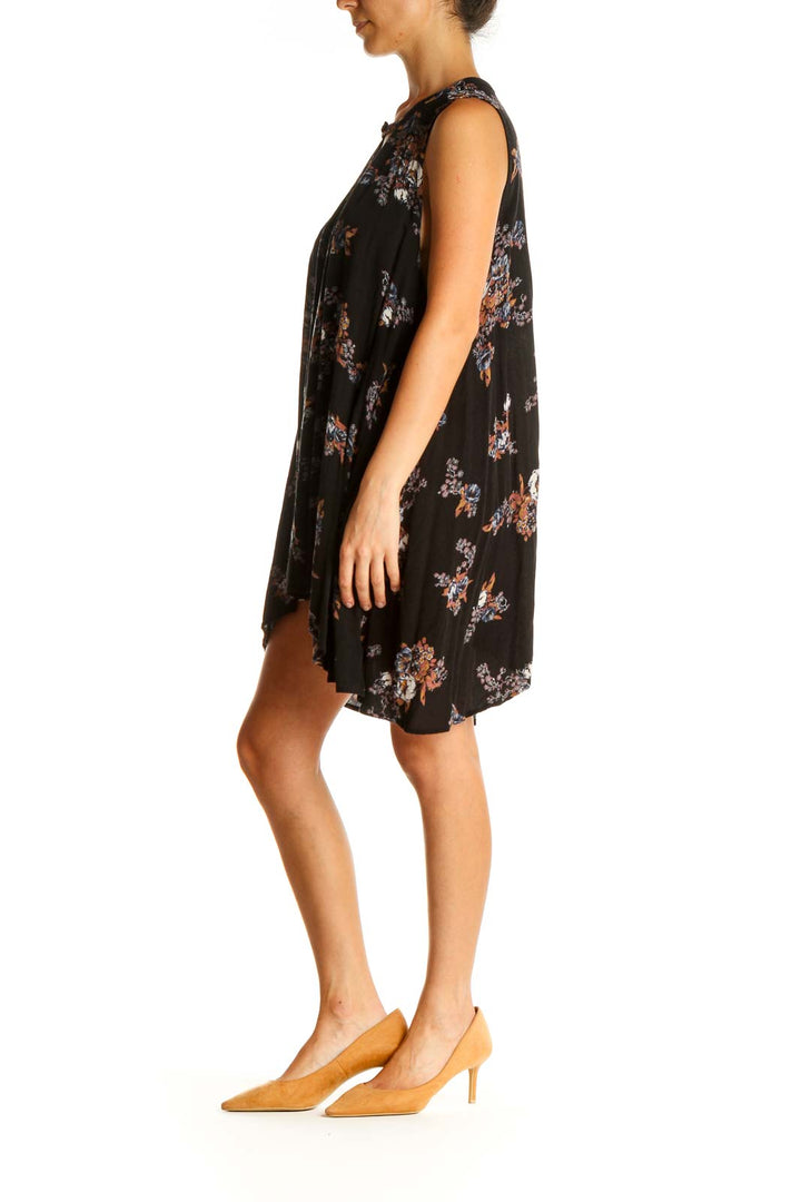 Front view of Free People black floral sleeveless swing tunic with keyhole neckline
