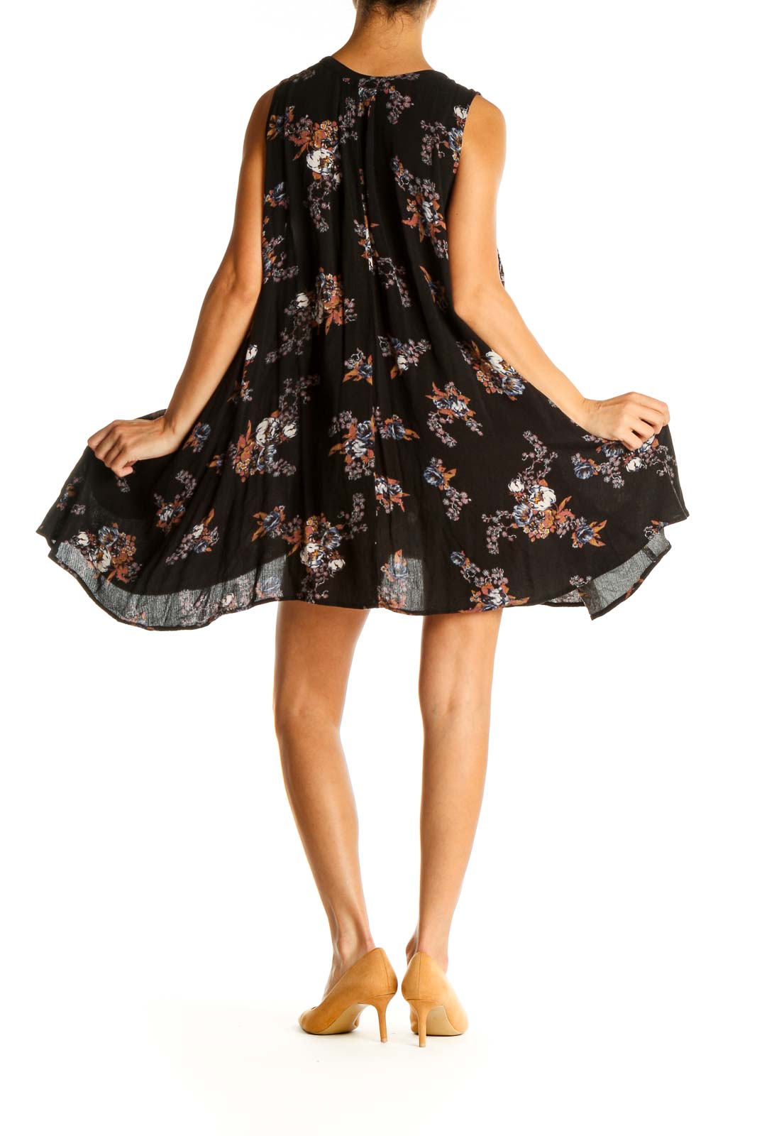 Back view of Free People black floral sleeveless swing tunic showing high-low hem