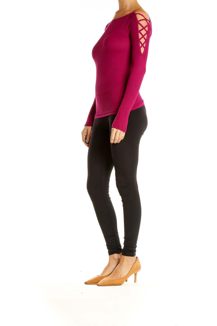 Front view of magenta Free People cold shoulder textured knit top