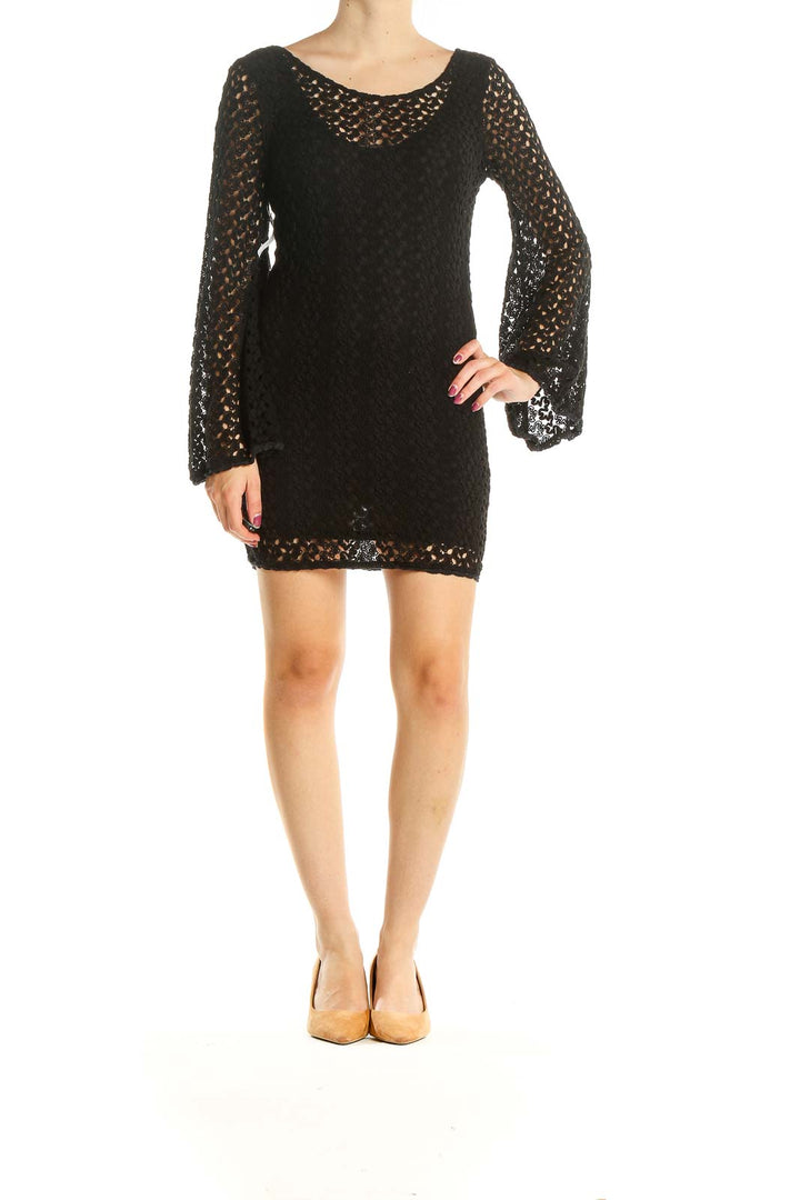 Front view of Free People black crochet mini dress with bell sleeves
