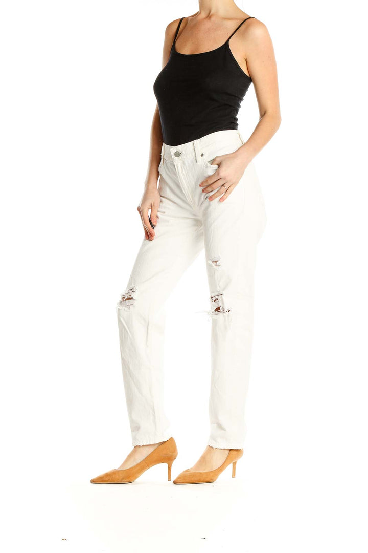 Front view of white distressed straight-leg jeans by Polo Ralph Lauren
