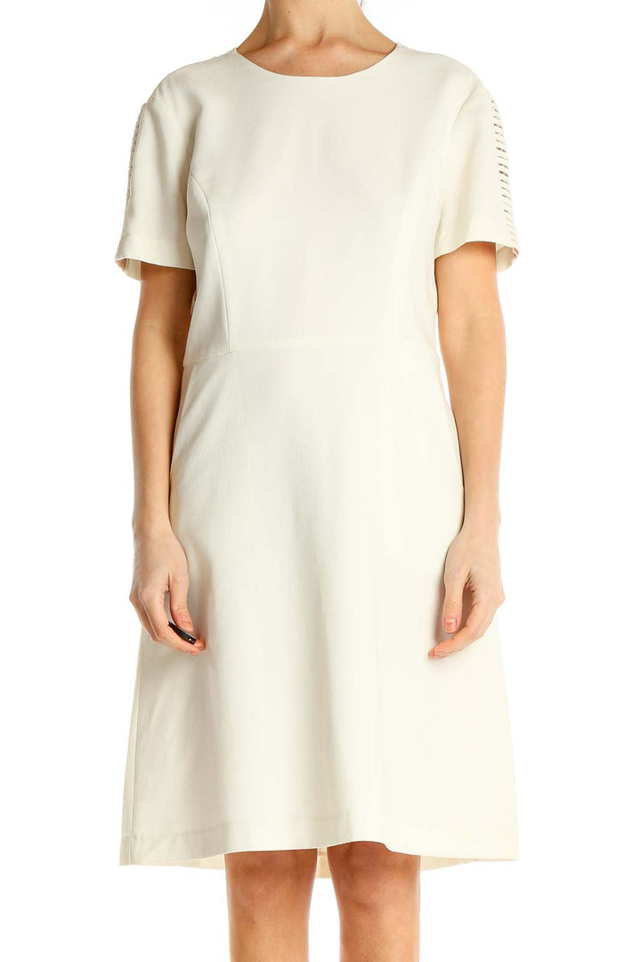 Front view of ivory BCBG MaxAzria A-line dress with cutout sleeve details