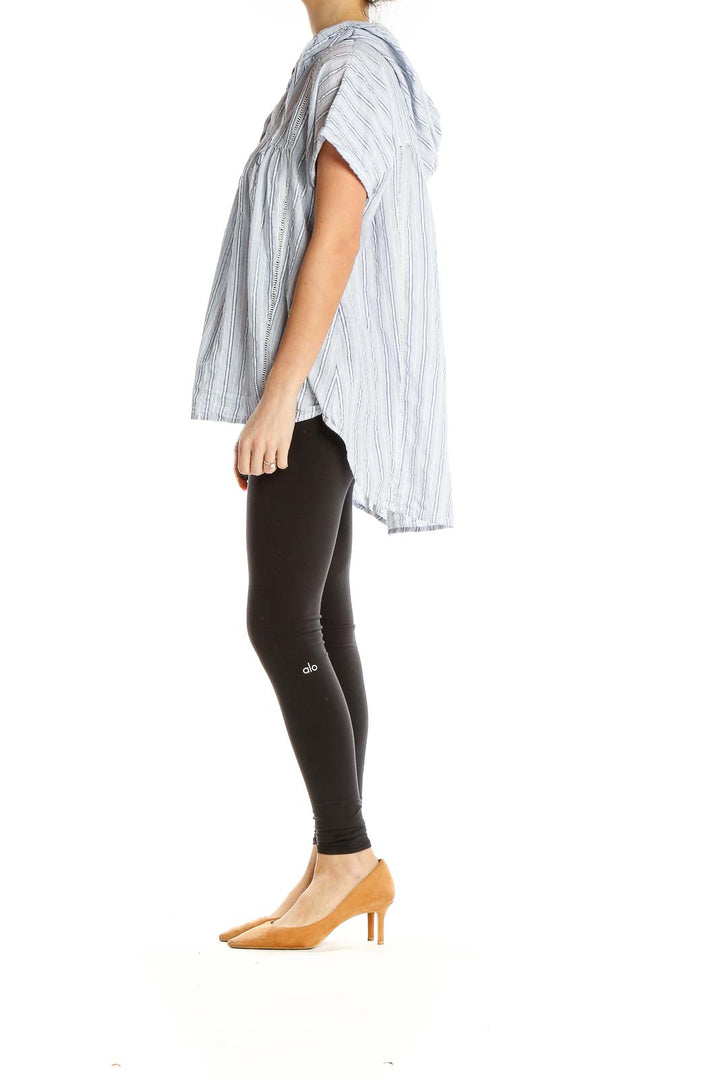 Front view of Doe & Rae white striped hooded blouse with empire waist