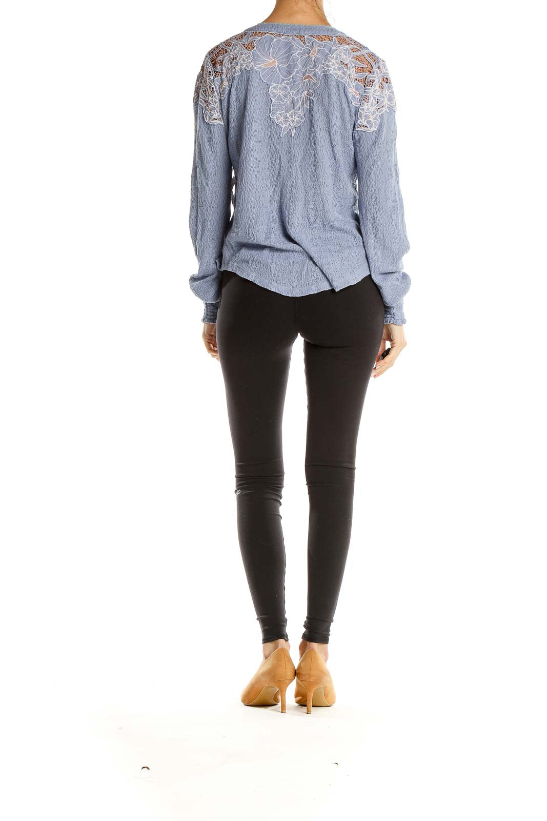 Back view of Free People blue Henley top showing lace detail