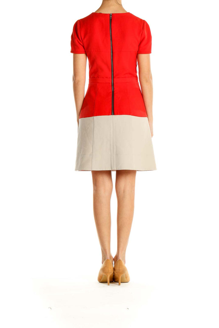 Side view of BCBG MaxAzria red and beige color block dress