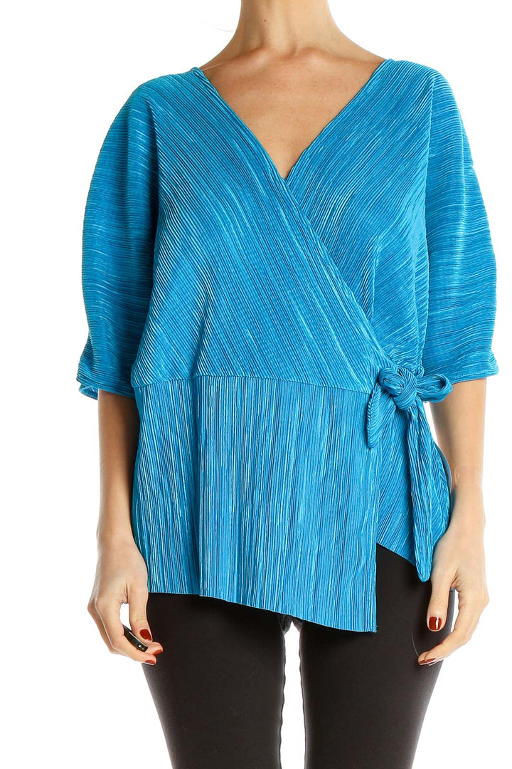 Front view of Halogen blue textured wrap-style blouse with V-neckline