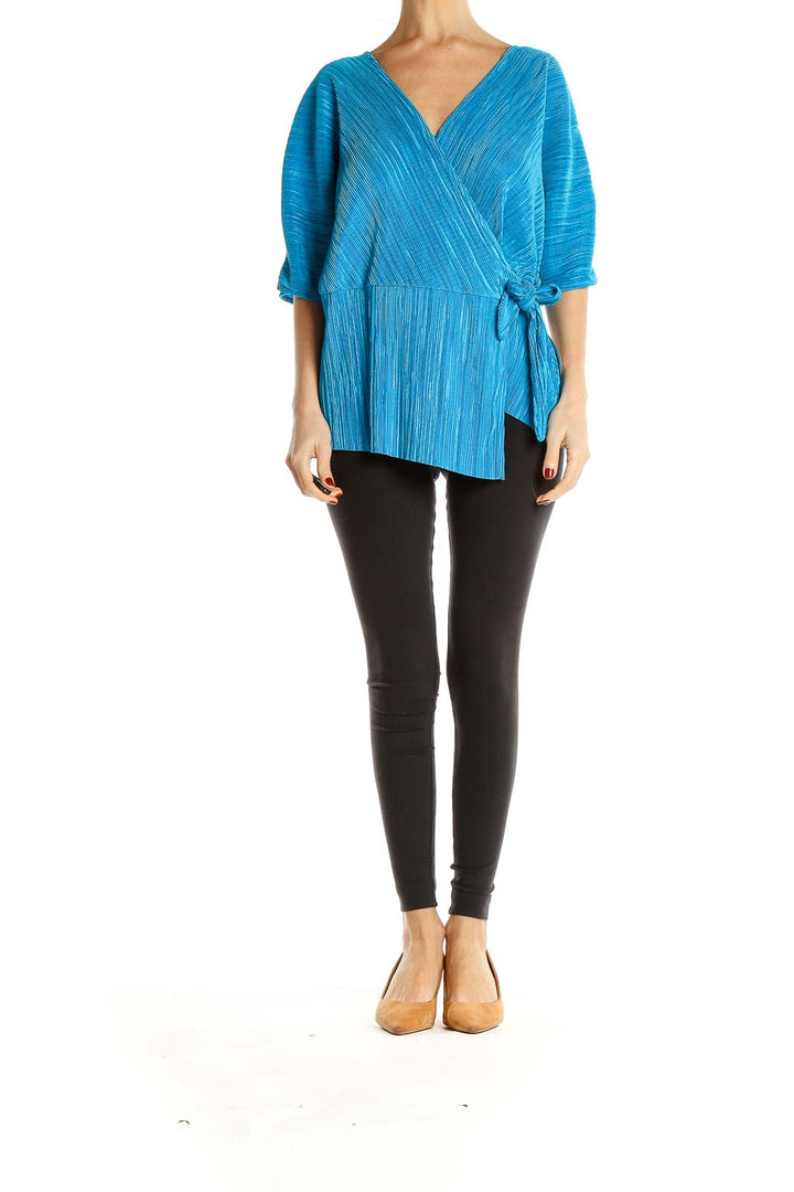 Front view of Halogen blue textured wrap-style blouse with V-neckline
