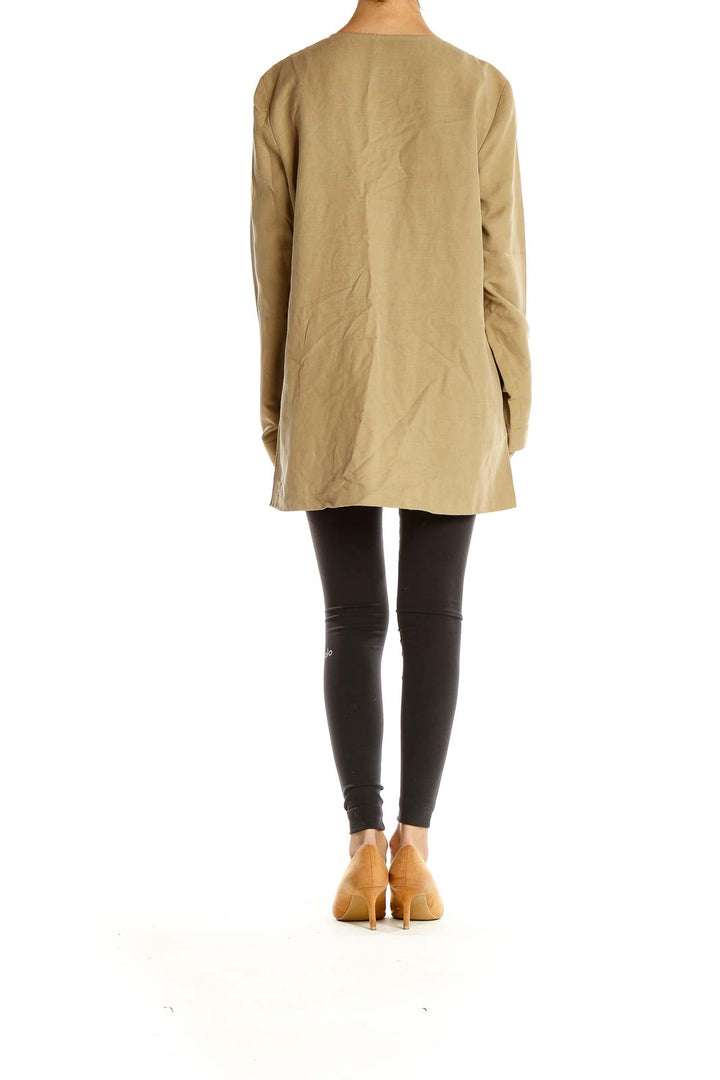 Side view of Studio G beige long coat showing length and fit