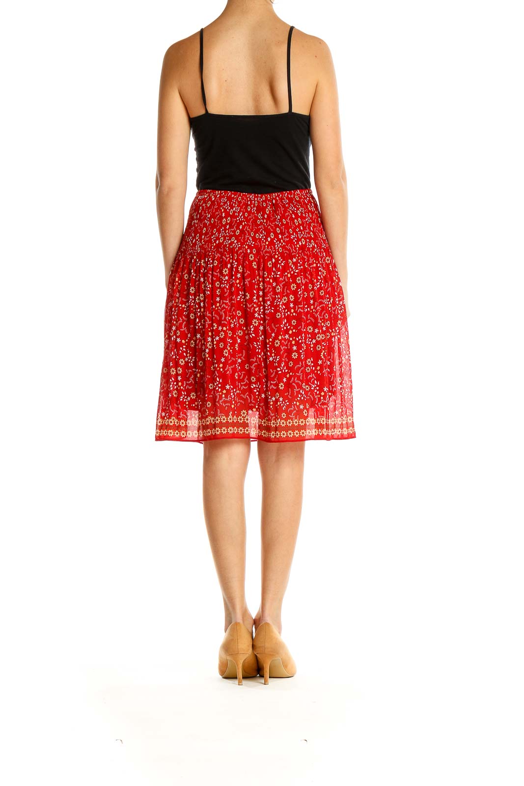 Side view of Max Studio red floral printed pleated midi skirt on model
