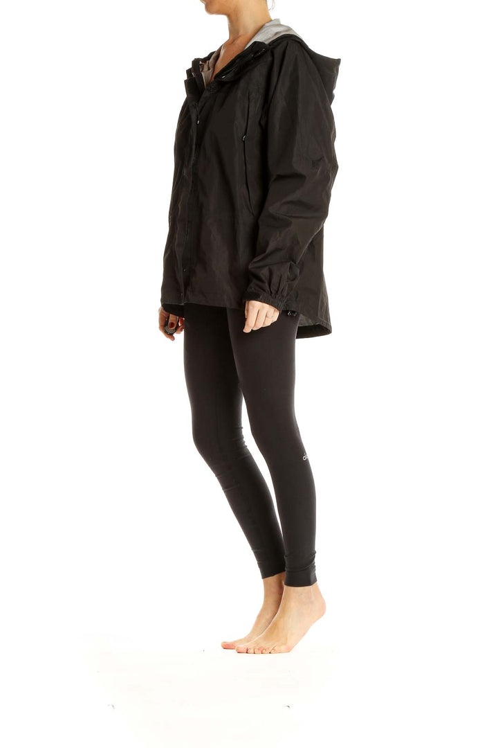 Front view of black L.L.Bean hooded rain jacket on model