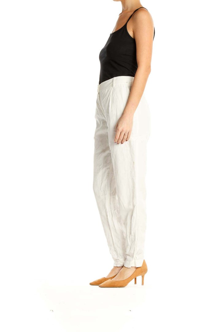 Front view of Nordstrom Signature white pleated straight-leg trousers