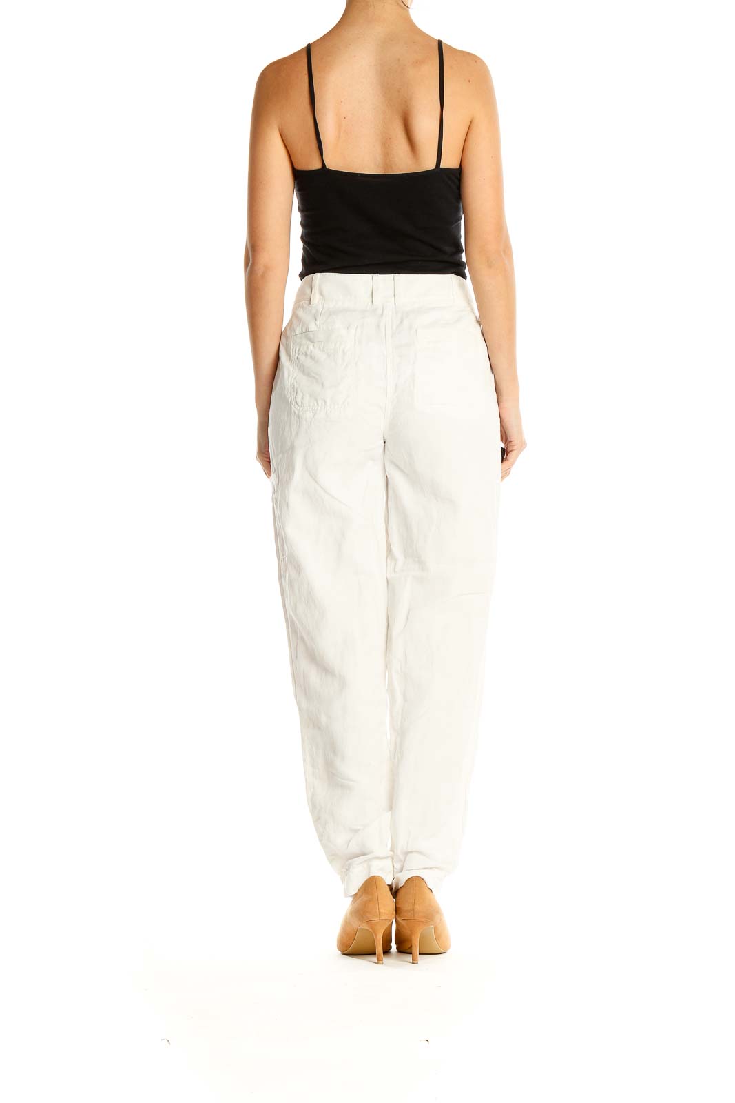 Side view of Nordstrom Signature white pleated straight-leg trousers on model