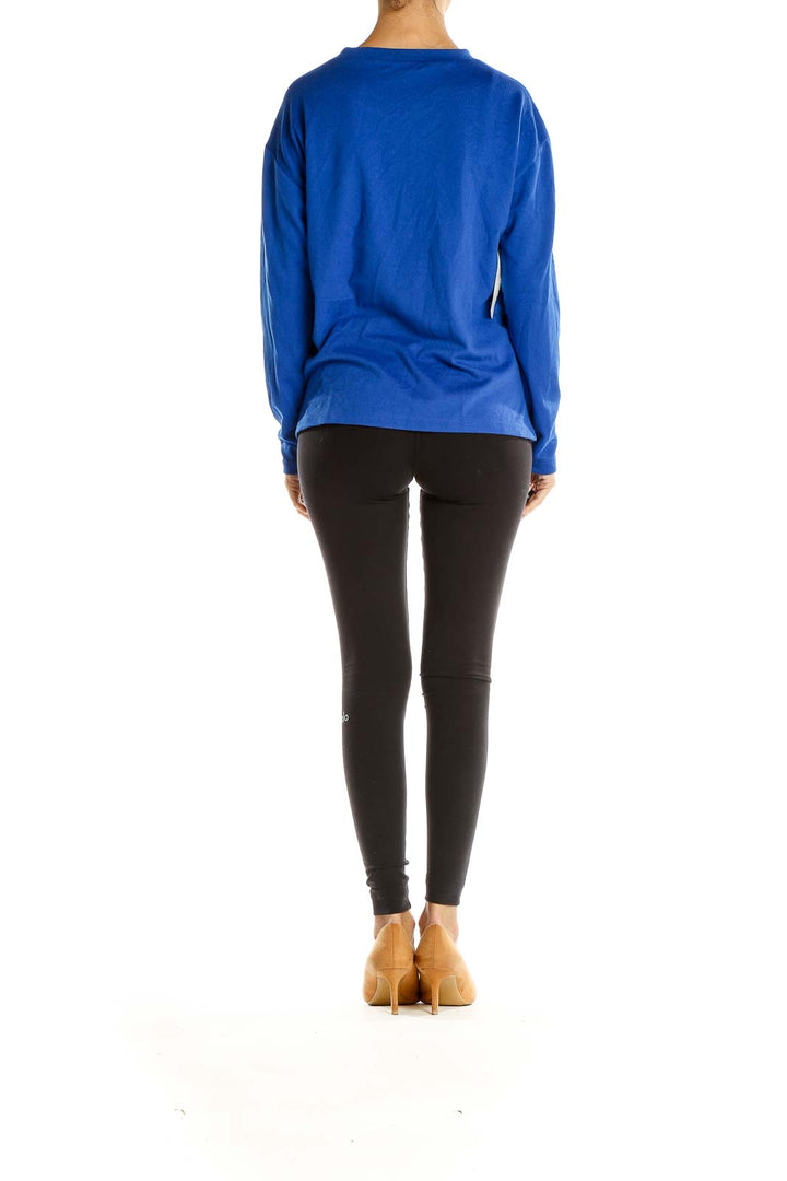 Side view of relaxed fit blue Sanctuary top on model