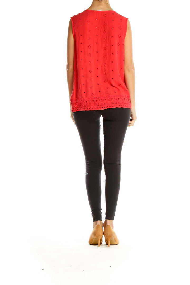 Side view of red eyelet lace sleeveless blouse from Gap on model