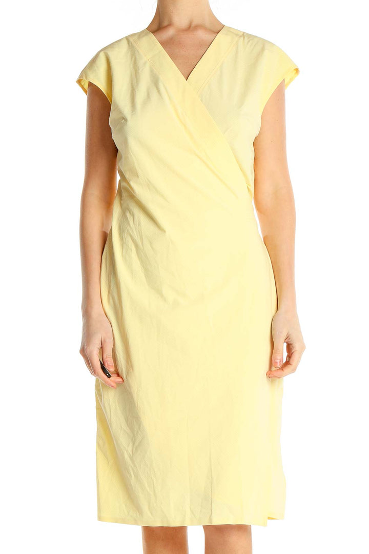 Front view of yellow Athleta wrap-style midi dress