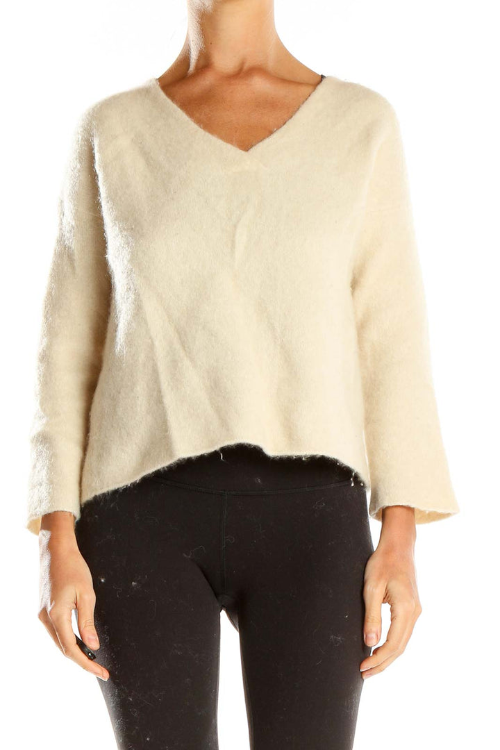 Front view of Eileen Fisher cream fuzzy knit V-neck sweater