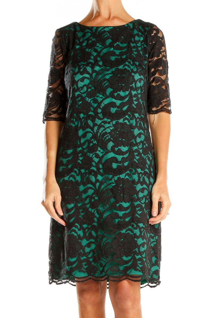 Front view of R&K Originals Black and Green Lace Overlay Dress with elbow-length sleeves