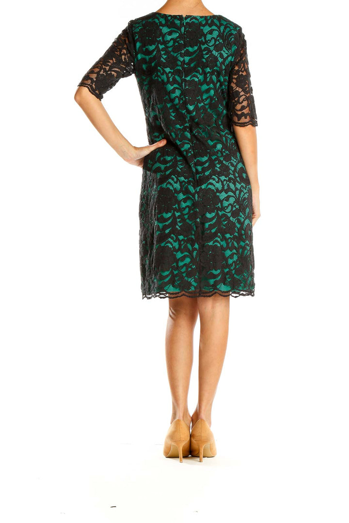 Side view of R&K Originals Black and Green Lace Overlay Dress showing A-line silhouette