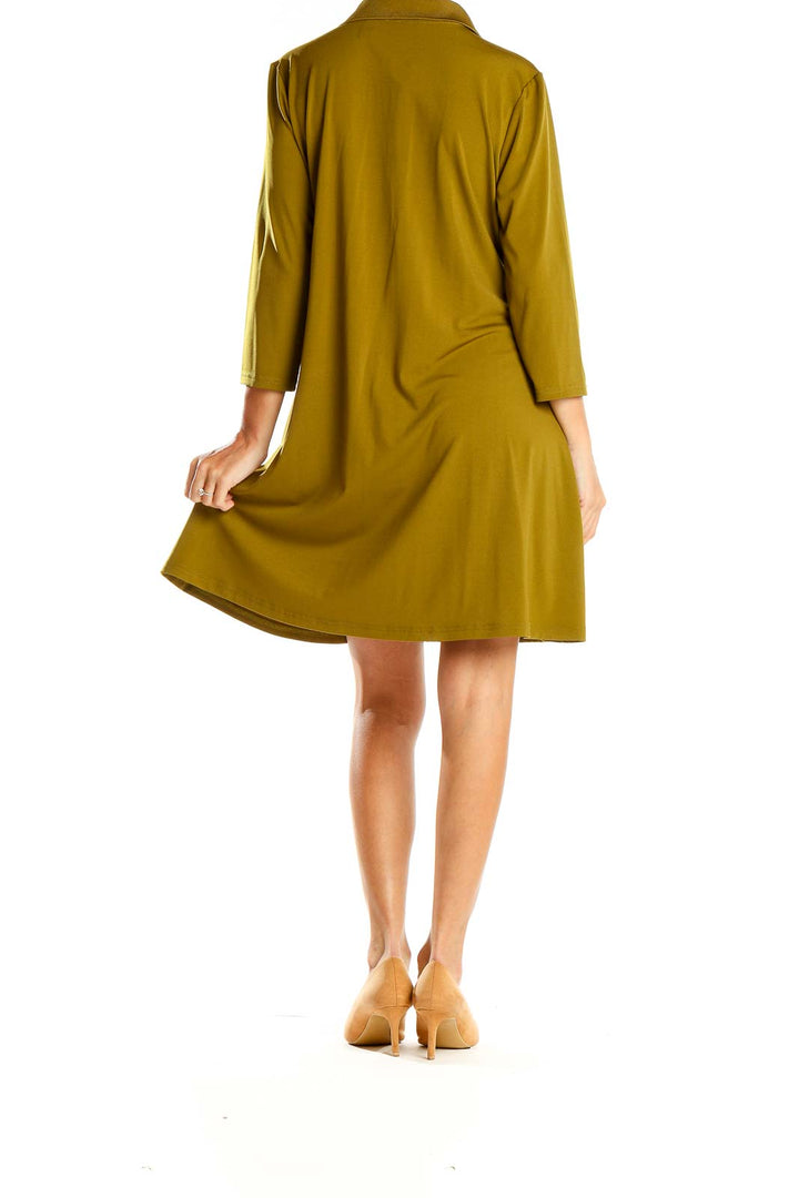 Side view of olive green H by Halston button-down shirt dress on model
