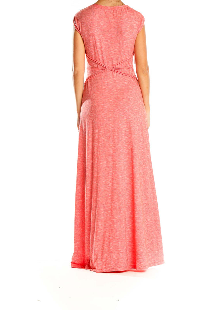Side view of coral heathered Max Studio maxi dress showing flowing skirt