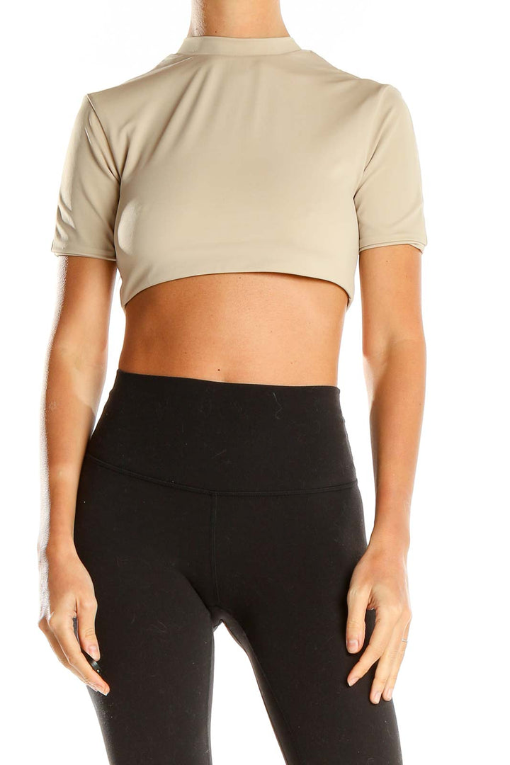 Front view of aexae beige cropped mock neck top