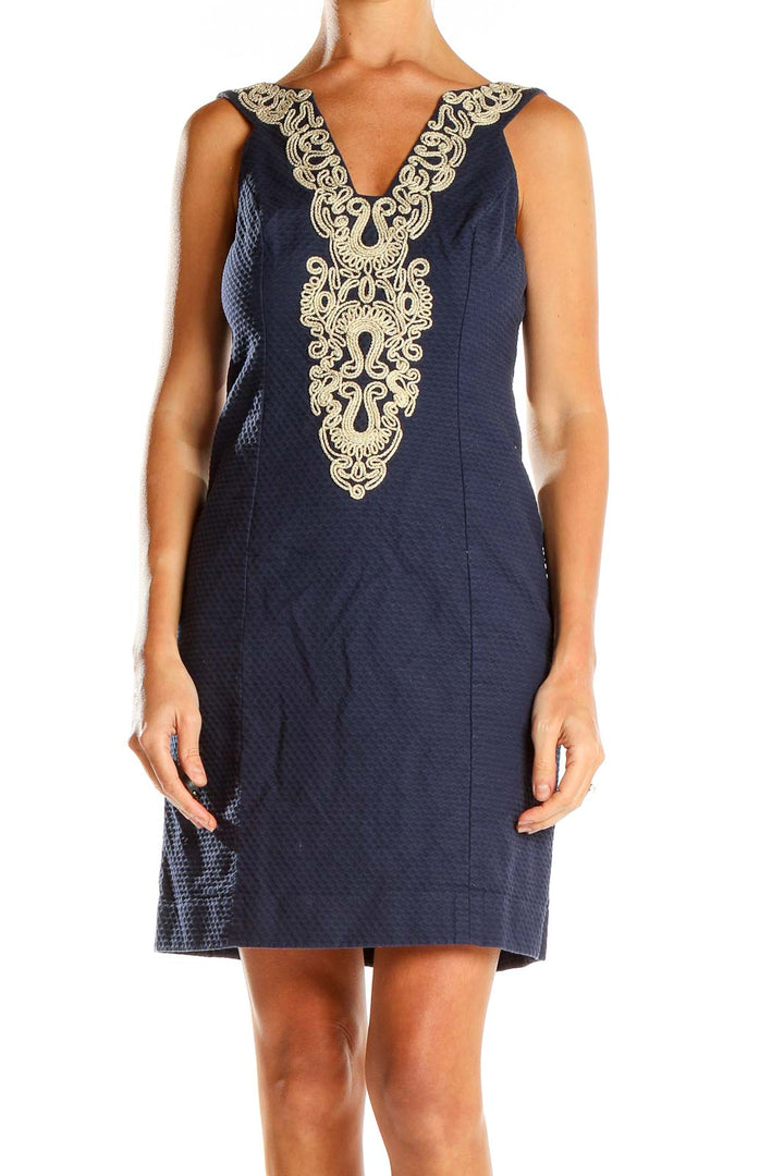 Front view of Lily Pulitzer navy shift dress with gold embroidery at V-neckline