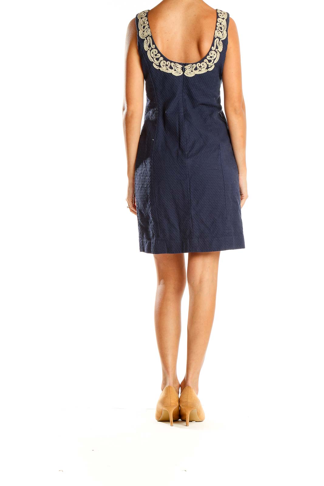 Side view of Lily Pulitzer navy shift dress showing sleeveless design and textured fabric