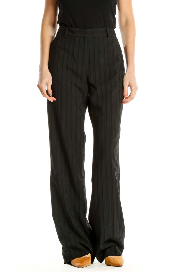 Front view of Antonio Melani black pinstriped wide-leg trousers