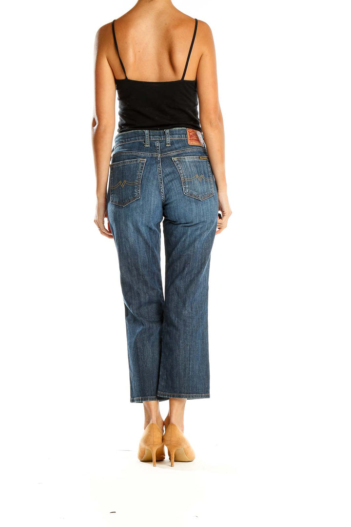 Side view of woman wearing Lucky Brand straight leg jeans with black top