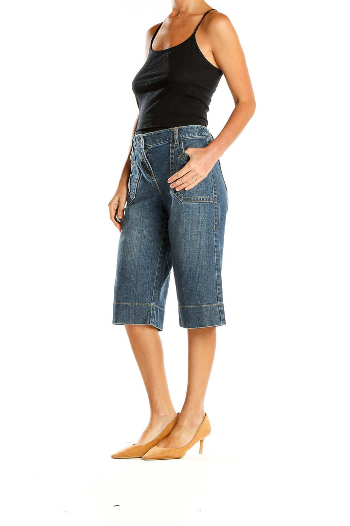 Front view of Ann Taylor LOFT Petites blue denim wide-leg cropped jeans