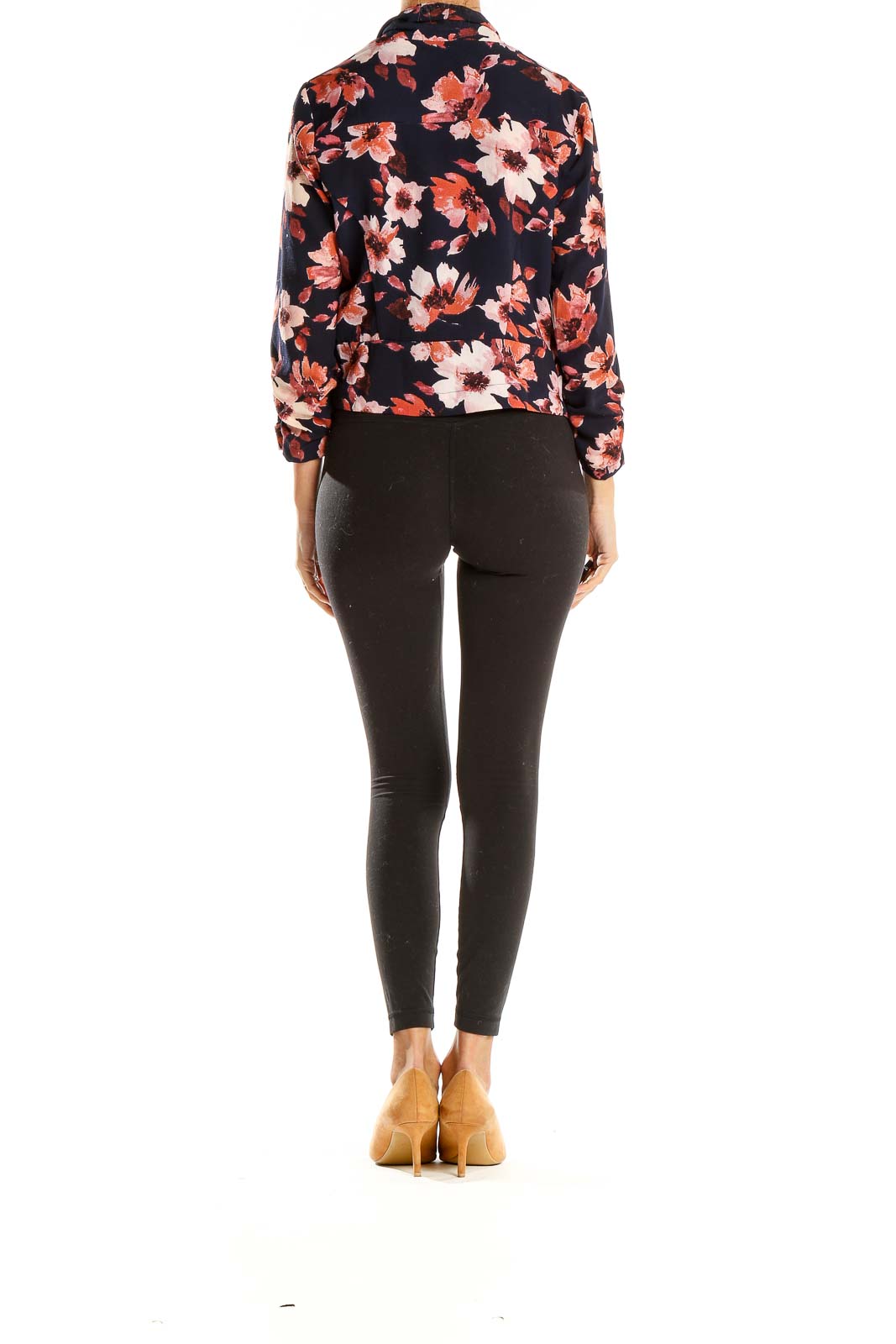 Side view of Iris Navy Floral Print Cropped Jacket on model with black pants