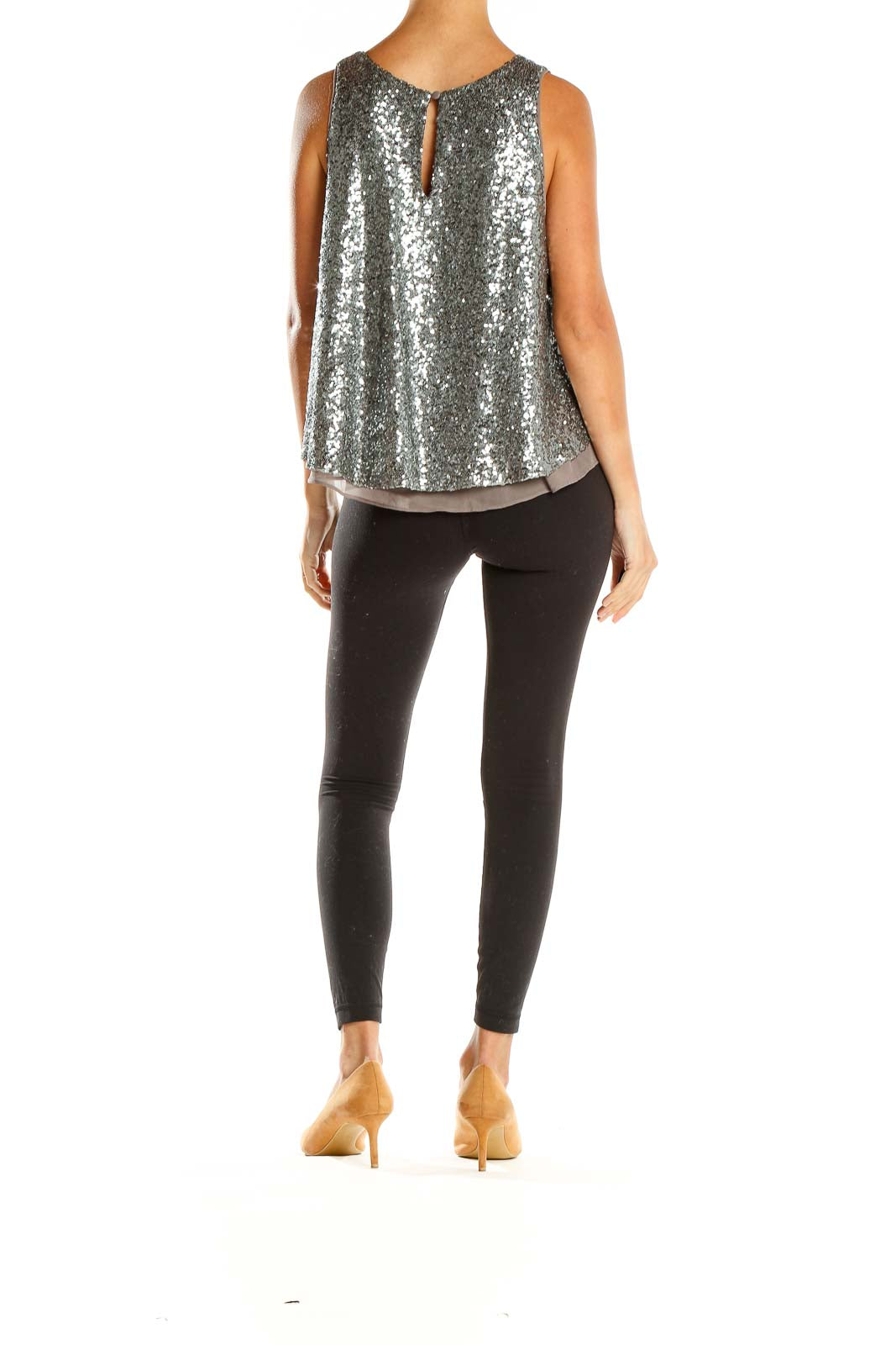 Side view of Sunday in Brooklyn silver sequin sleeveless swing top with black pants