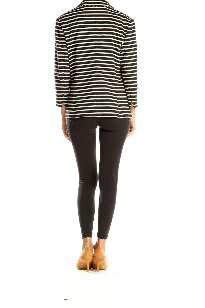 Back view of Black and White Striped Blazer by Christian Siriano New York on model with black pants