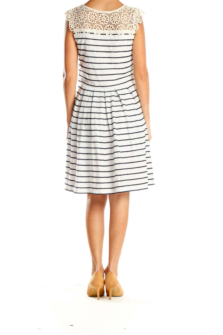 Back view of Bordeaux white and navy striped dress showing fit-and-flare silhouette