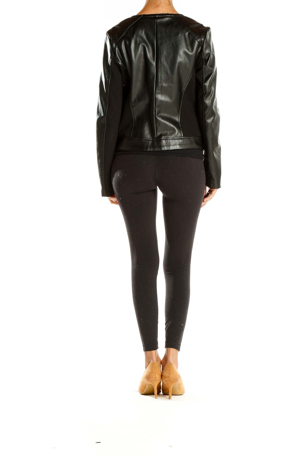 Back view of Premise Studio black faux leather jacket on model with leggings