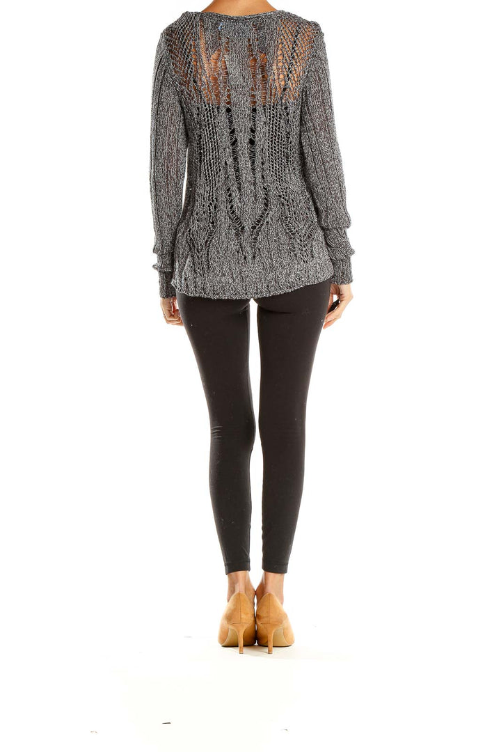 Side view of gray open-knit sweater by Simply Vera Vera Wang with black leggings