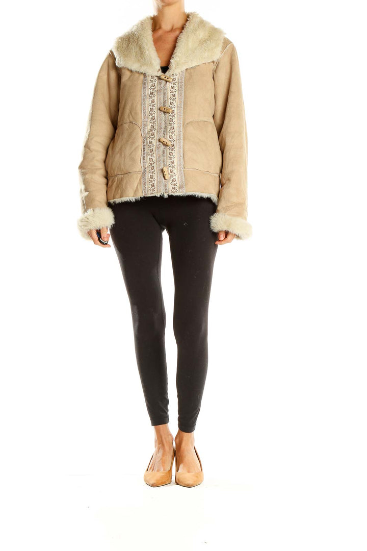 Front view of beige Coldwater Creek coat with faux fur collar and embroidered details