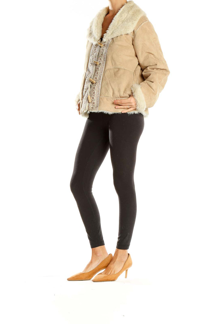 Front view of beige Coldwater Creek coat with faux fur collar and embroidered details