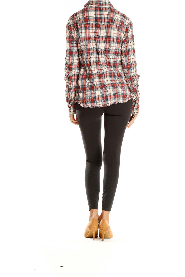 Side view of J.Crew red plaid cotton button-down shirt paired with black leggings