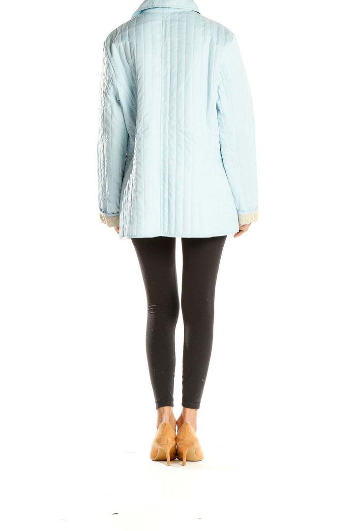 Side view of Dana Buchman light blue quilted zip-up jacket on model