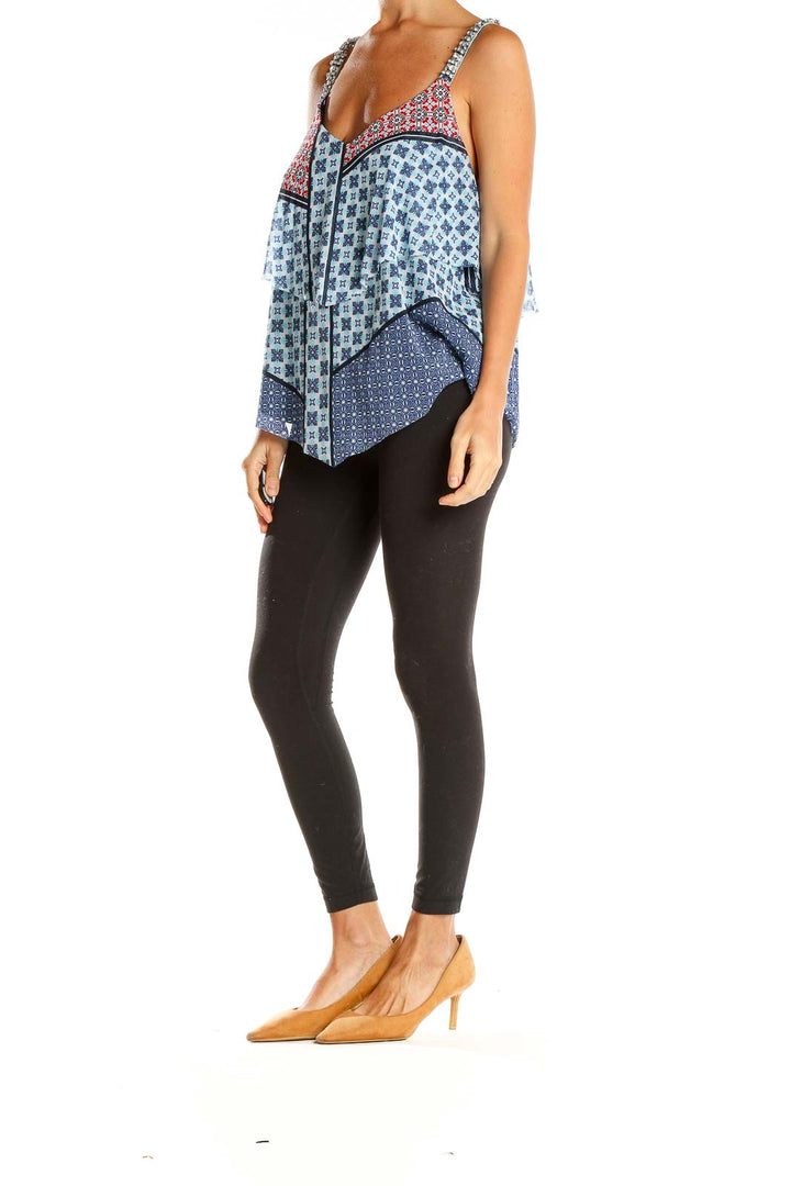 Front view of INC XL layered tank top with blue and red patterns and rhinestone straps